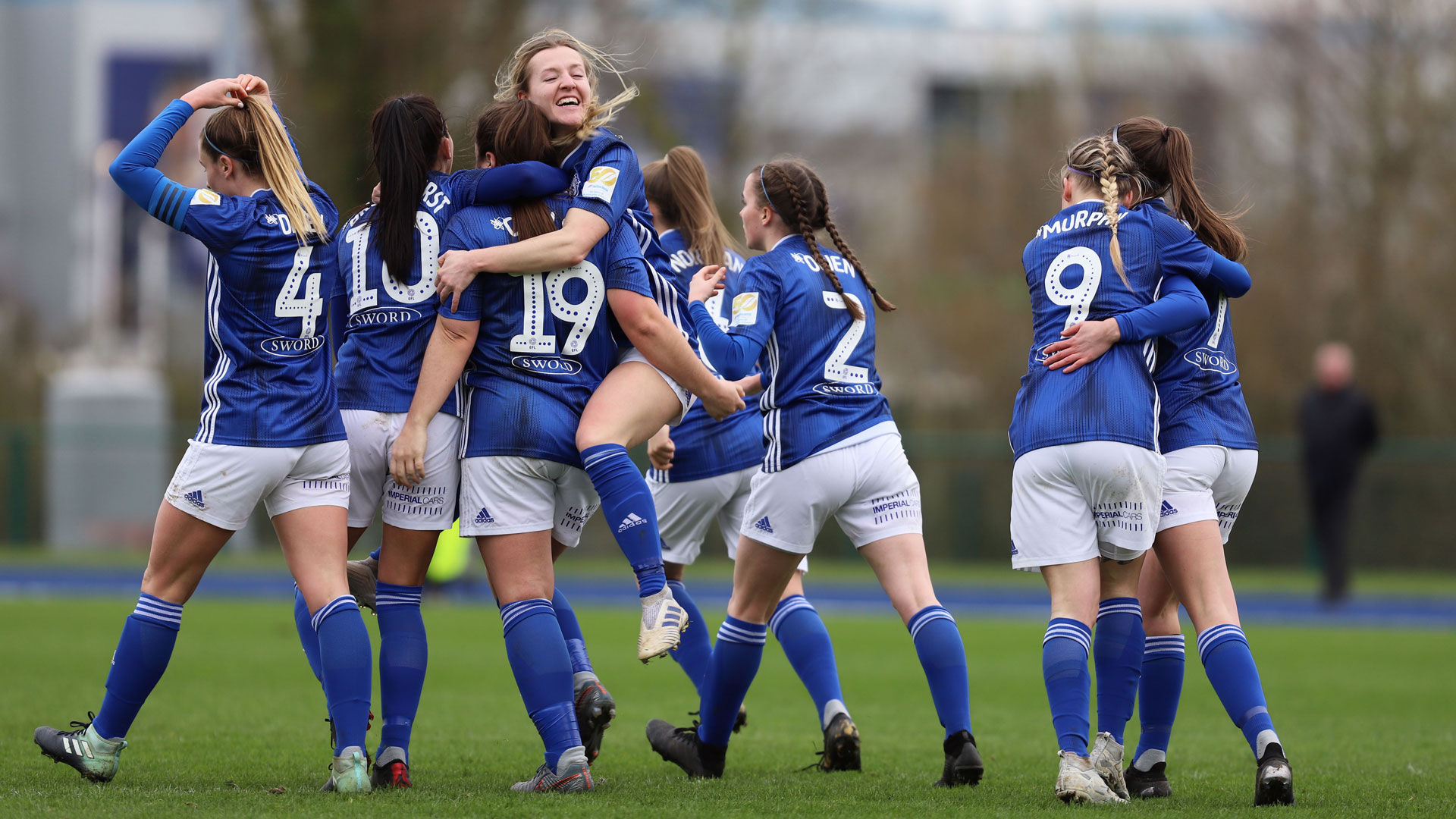 The City Women's team celebrate...