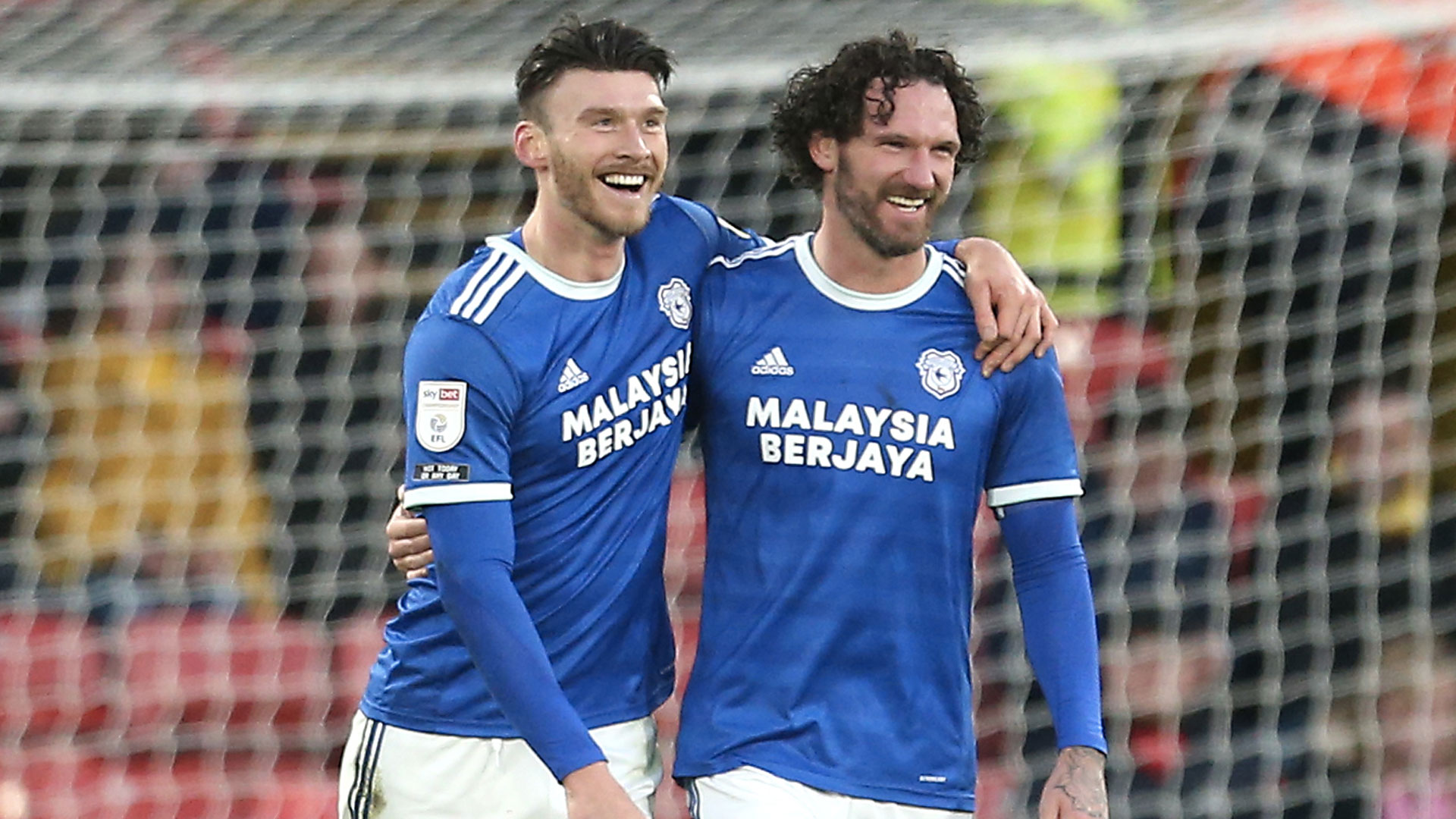 City skipper Sean Morrison celebrates with Kieffer Moore at Watford...