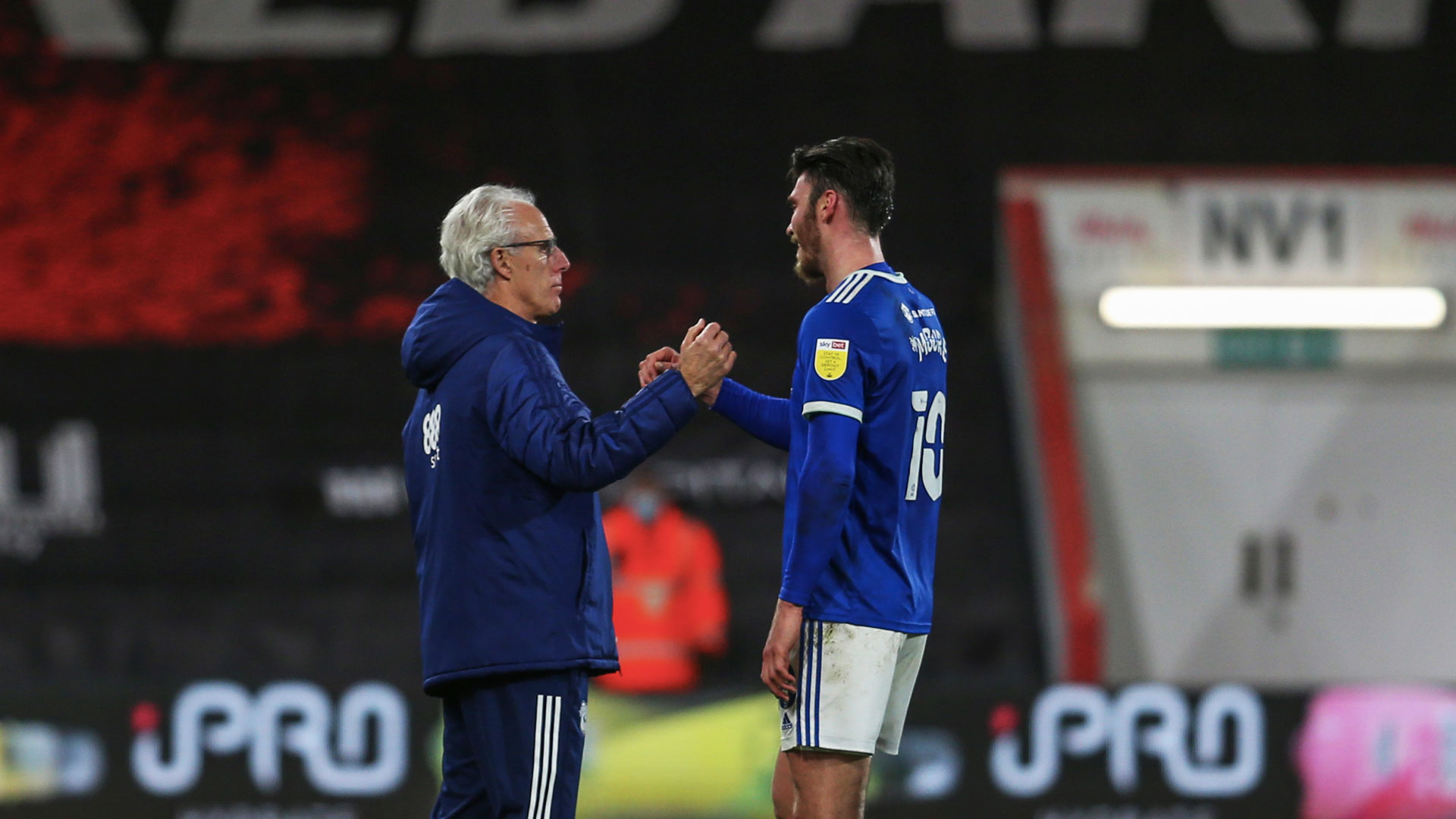 Mick celebrates with goalscorer Kieffer Moore...