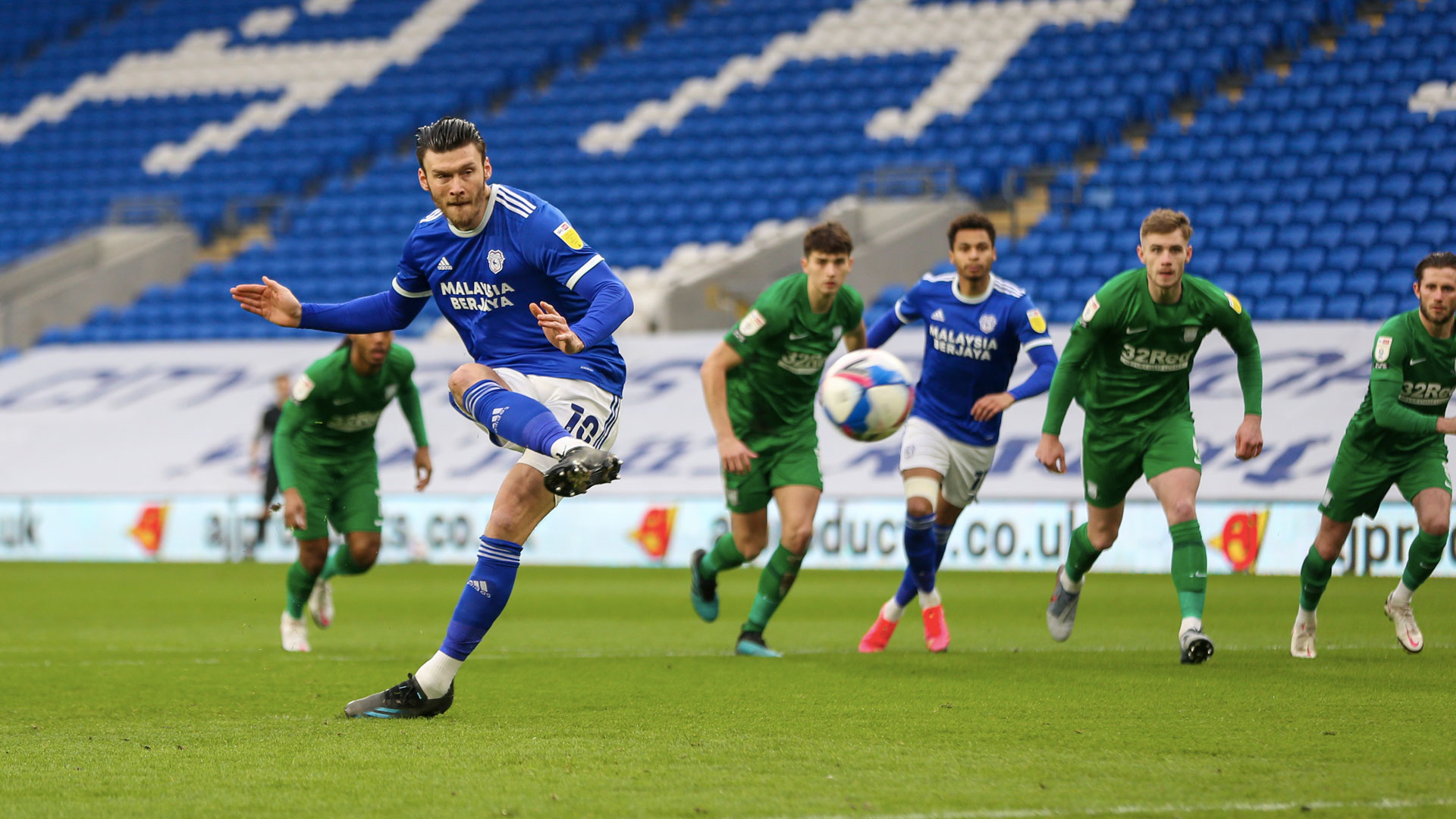 Kieffer Moore scores a penalty against Preston...