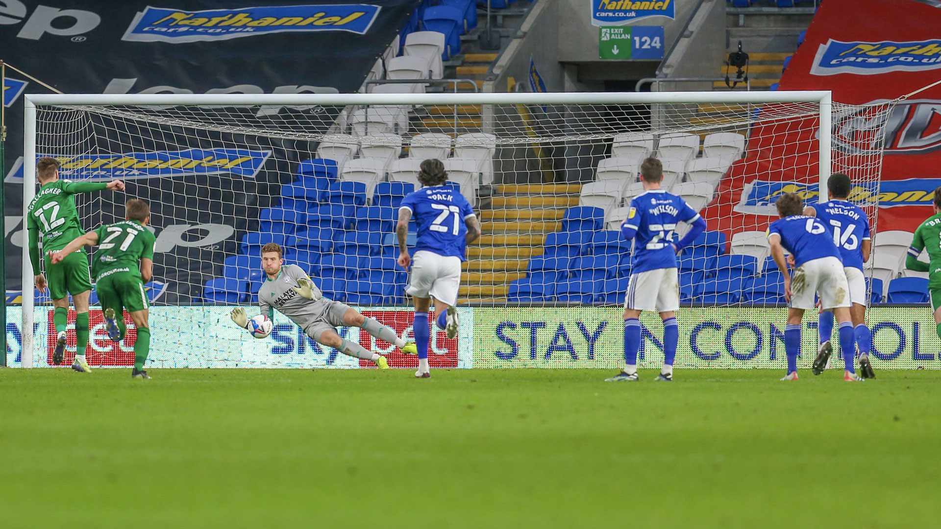 Dillon Phillips saves Gallagher's penalty...