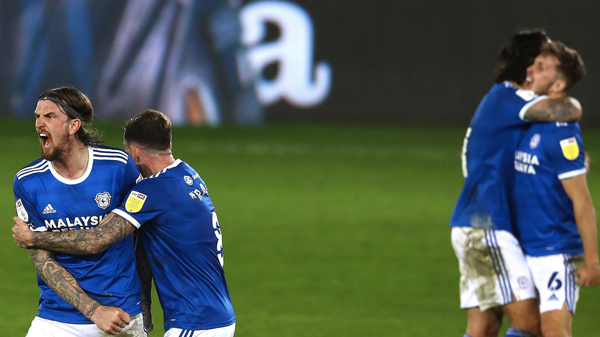 Ralls hugs Aden Flint, scorer of the winner...