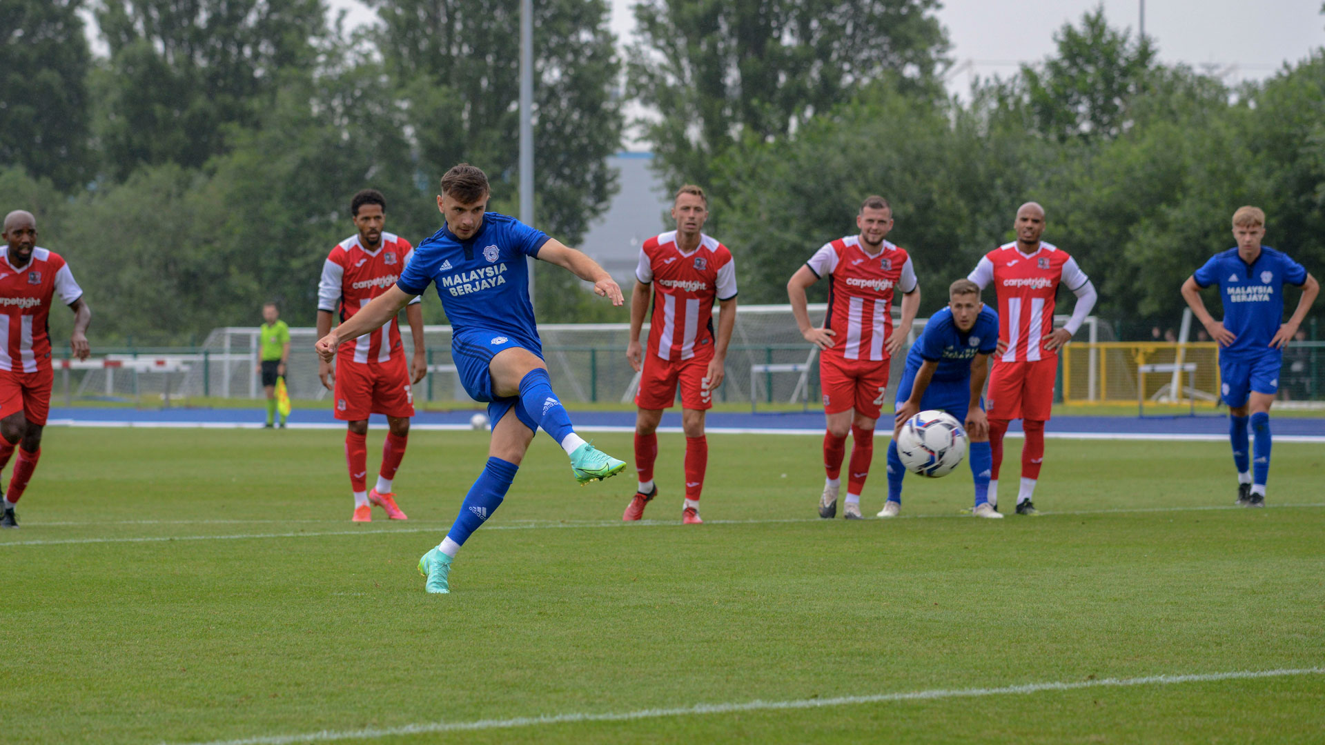 Mark Harris scores his penalty against Exeter City...