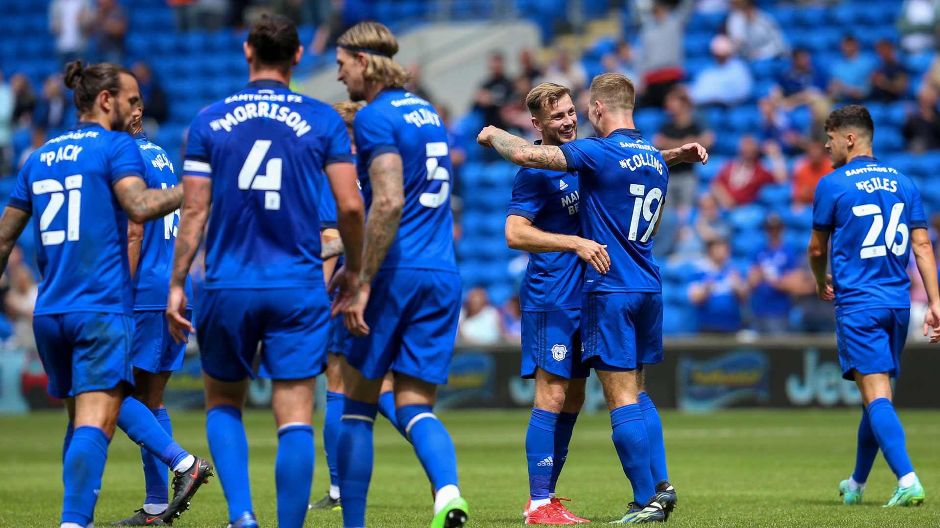 Joe Ralls celebrates his pre-season thunderbolt with James Collins...