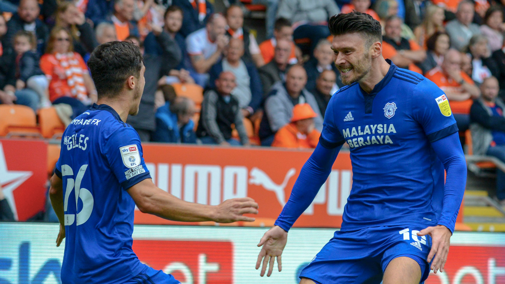 Kieffer Moore celebrates with Ryan Giles at Blackpool...