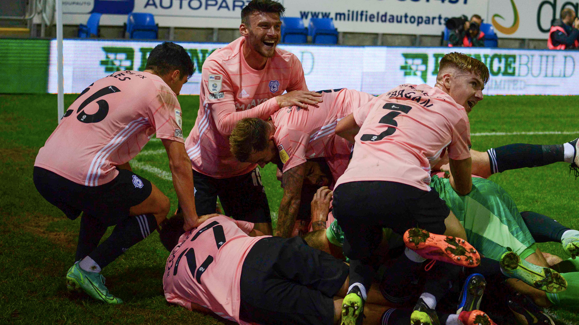 Aden Flint under his teammates in celebration at London Road...