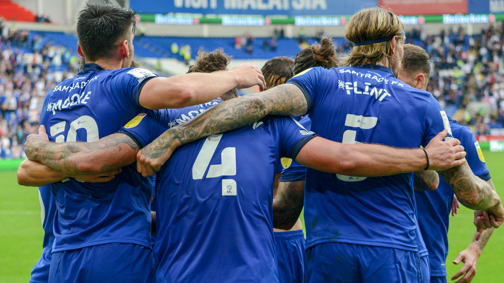 Kieffer Moore, Sean Morrison and Aden Flint celebrate at CCS...