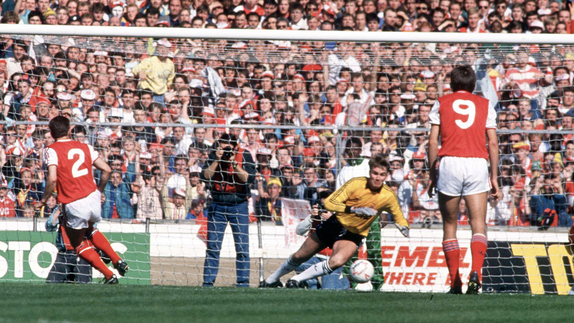 Andy Dibble saves a penalty against Arsenal...