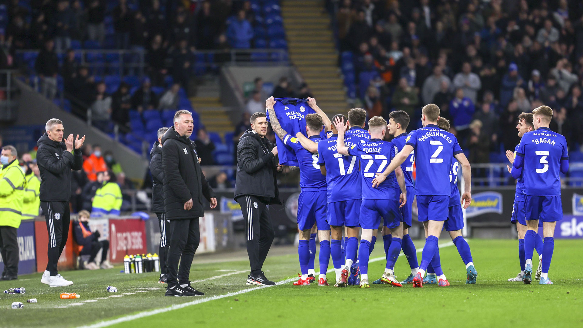 The Bluebirds hold-up a shirt in support of skipper Sean Morrison...