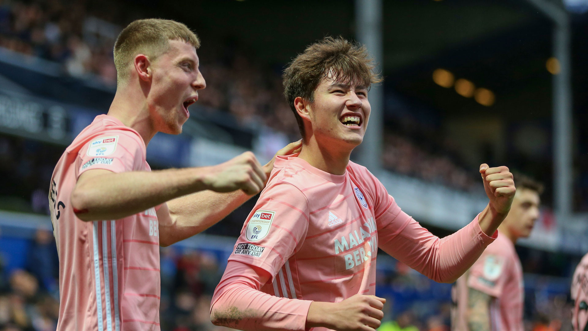 Rubin Colwill and Mark McGuinness celebrate in West London...