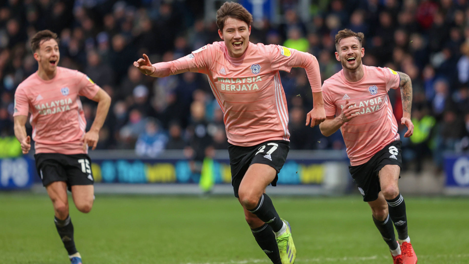 Rubin Colwill celebrates his winner with Joe Ralls and Ryan Wintle...