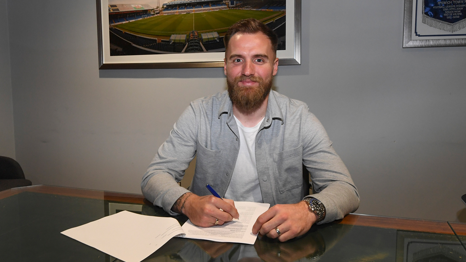 Jak Alnwick signs his agreement at CCS...
