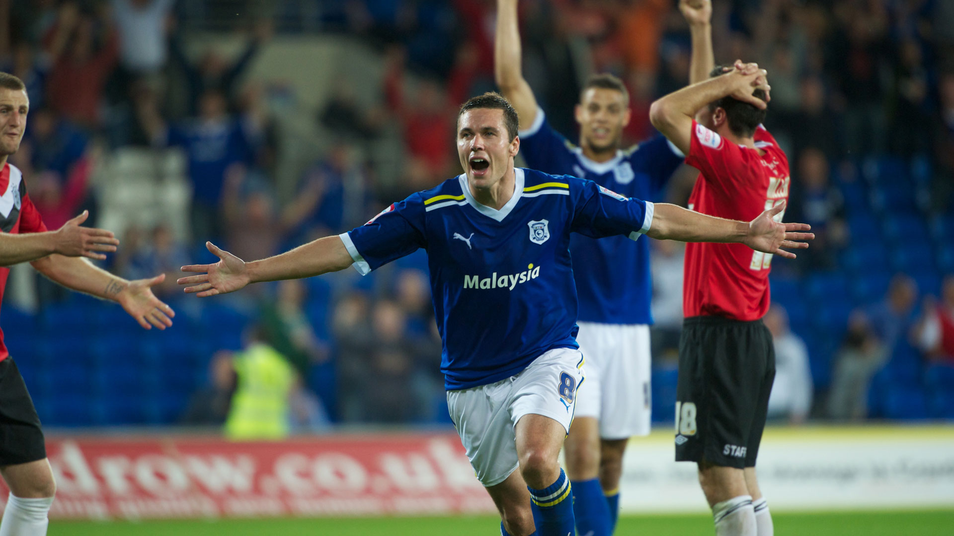 Don Cowie celebrates against Huddersfield Town...