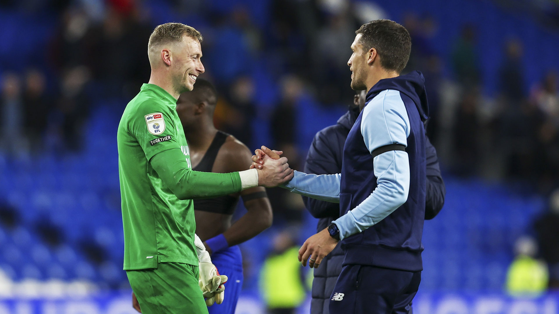 Ryan Allsop celebrates his penalty save with Mark Hudson...