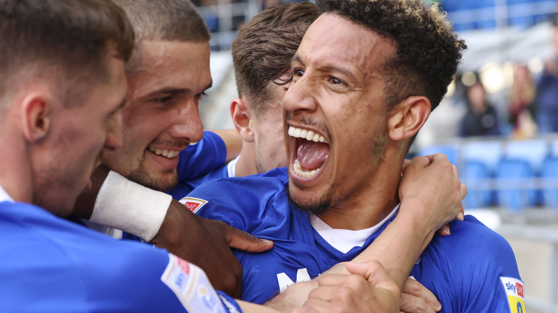 Callum Robinson celebrates his equaliser against Burnley...