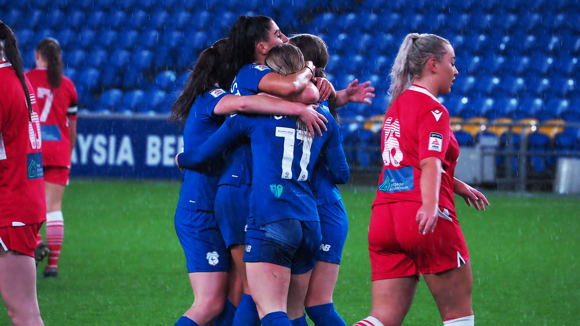 The Bluebirds celebrate with Danielle Green...