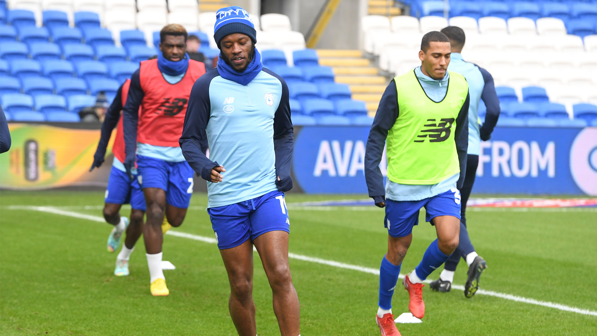 Romaine Sawyers and Andy Rinomhota warm up ahead of kick-off...