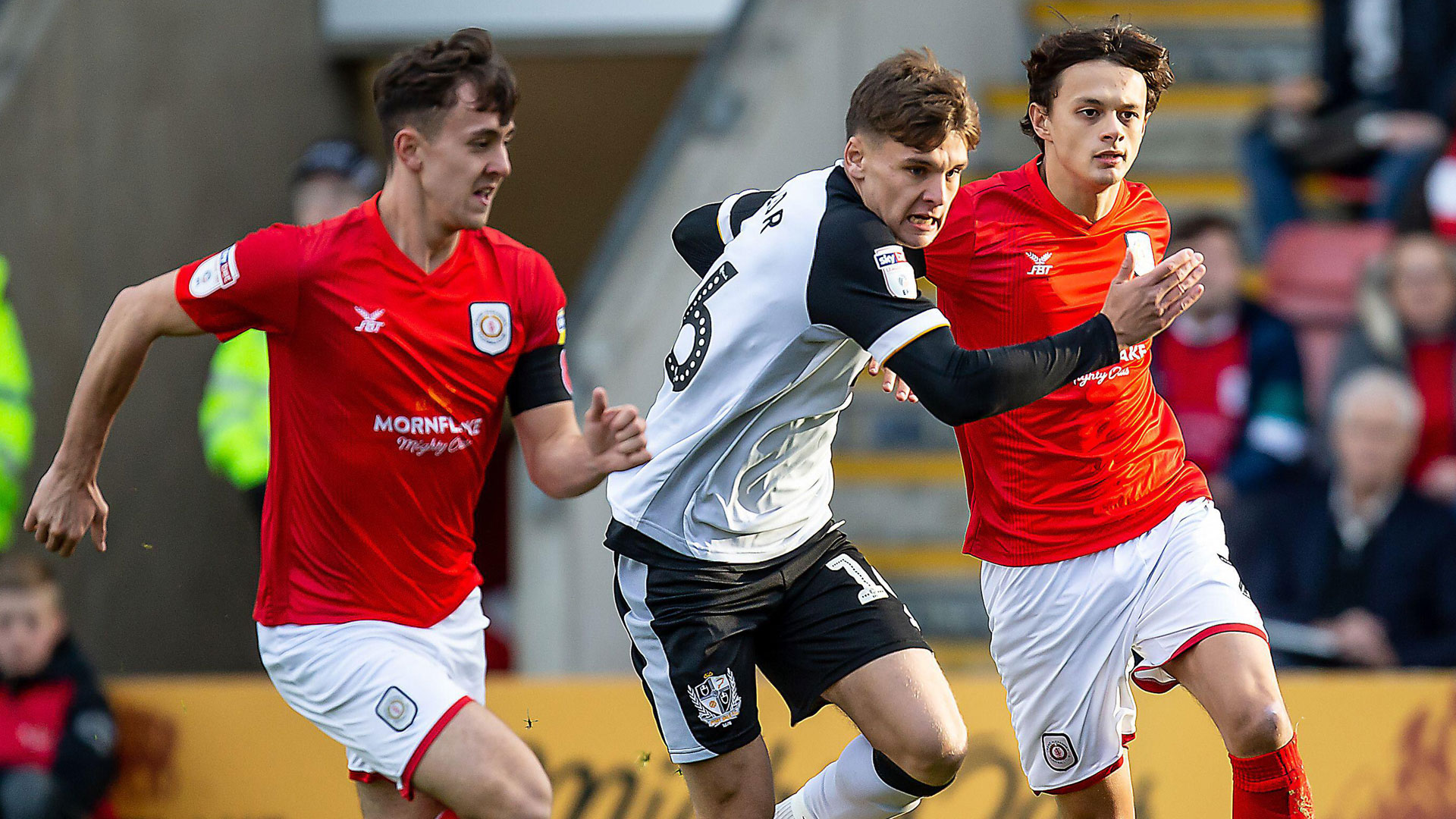 Ryan Wintle and Perry Ng in action for Crewe against Port Vale...