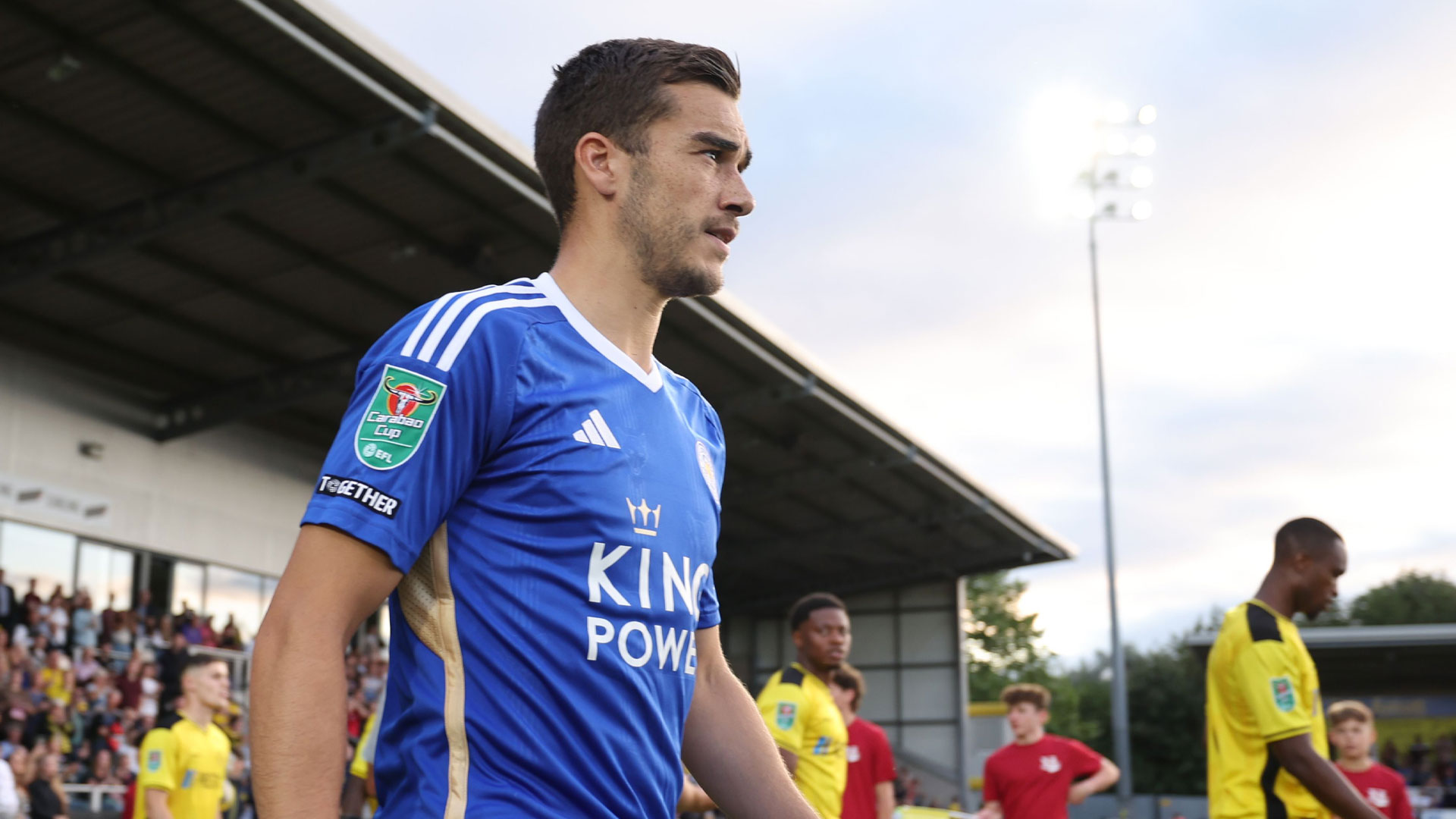 Harry Winks walks onto the field for Leicester City vs. Burton Albion