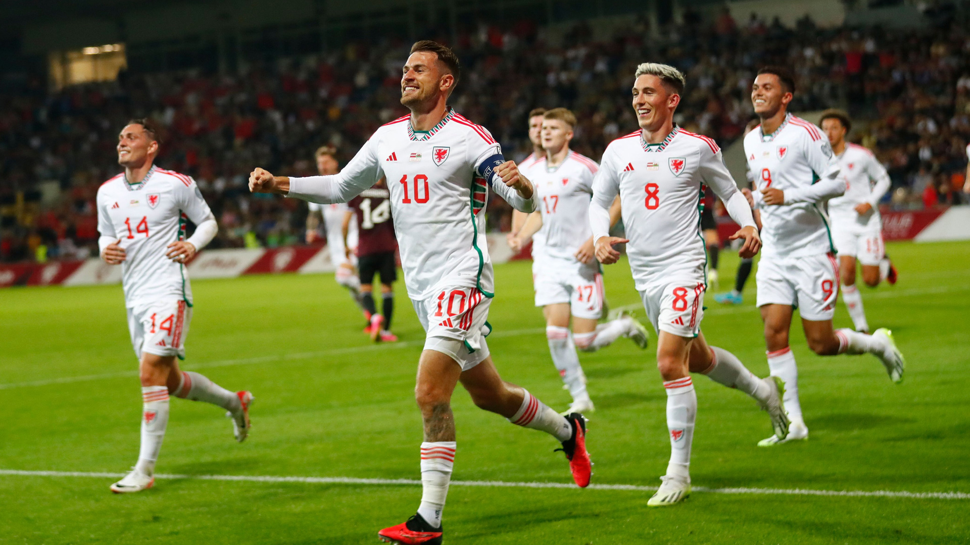 Aaron Ramsey celebrates scoring for Wales