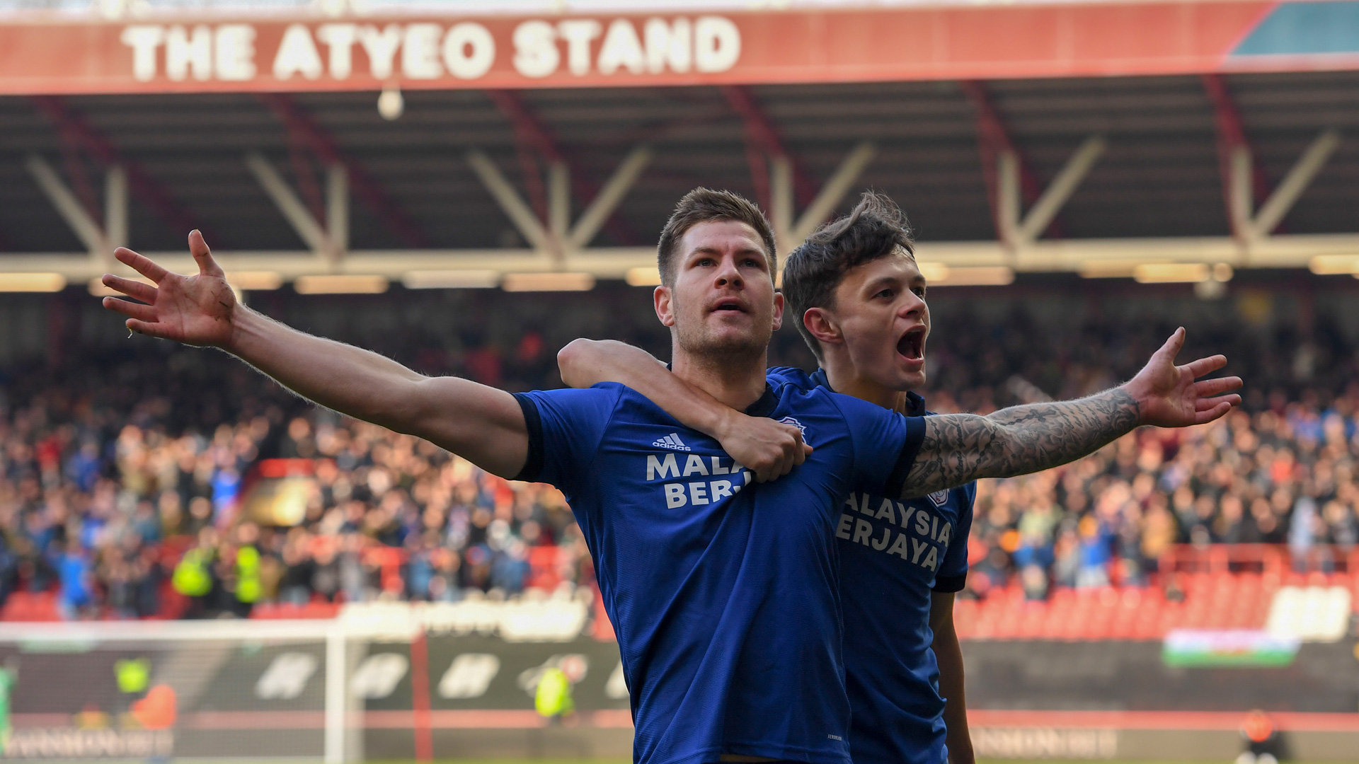 James Collins and Perry Ng celebrate at Ashton Gate...