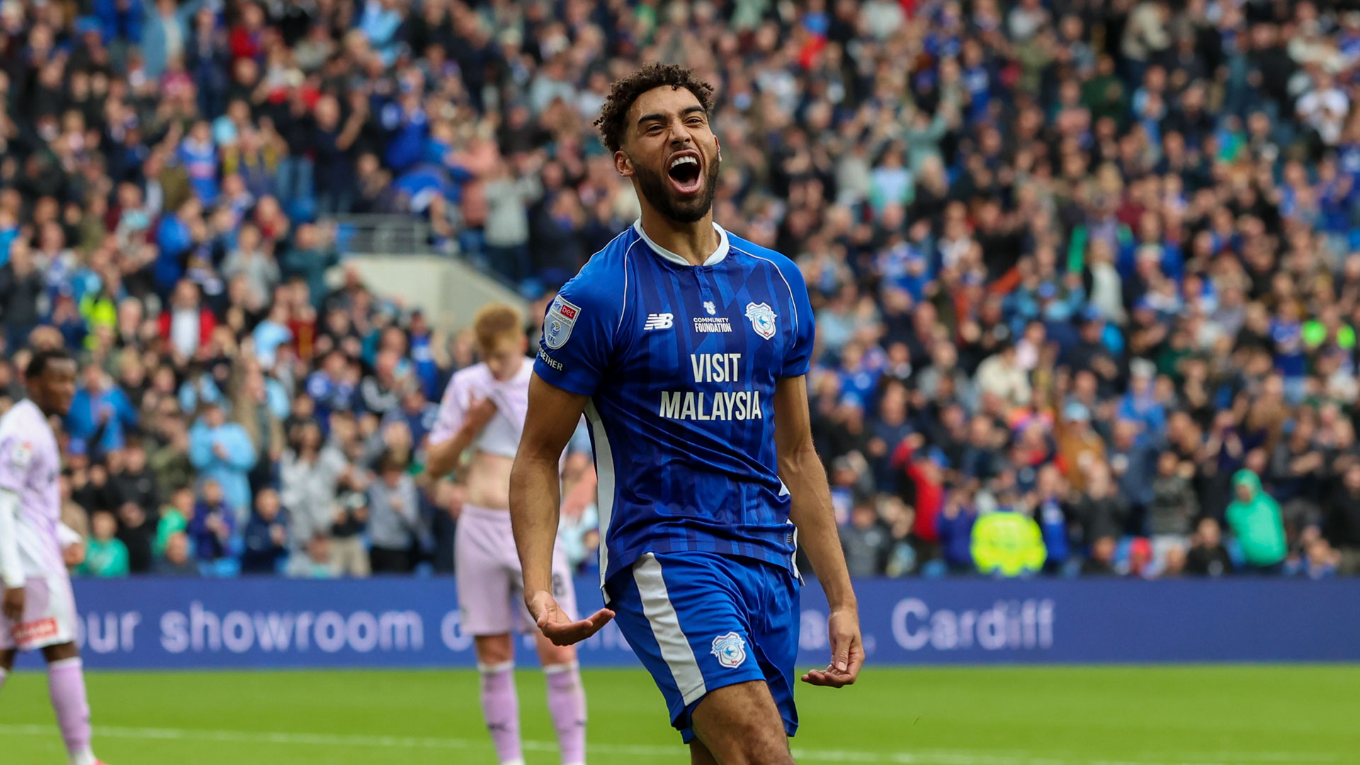 Kion Etete celebrates scoring for Cardiff City