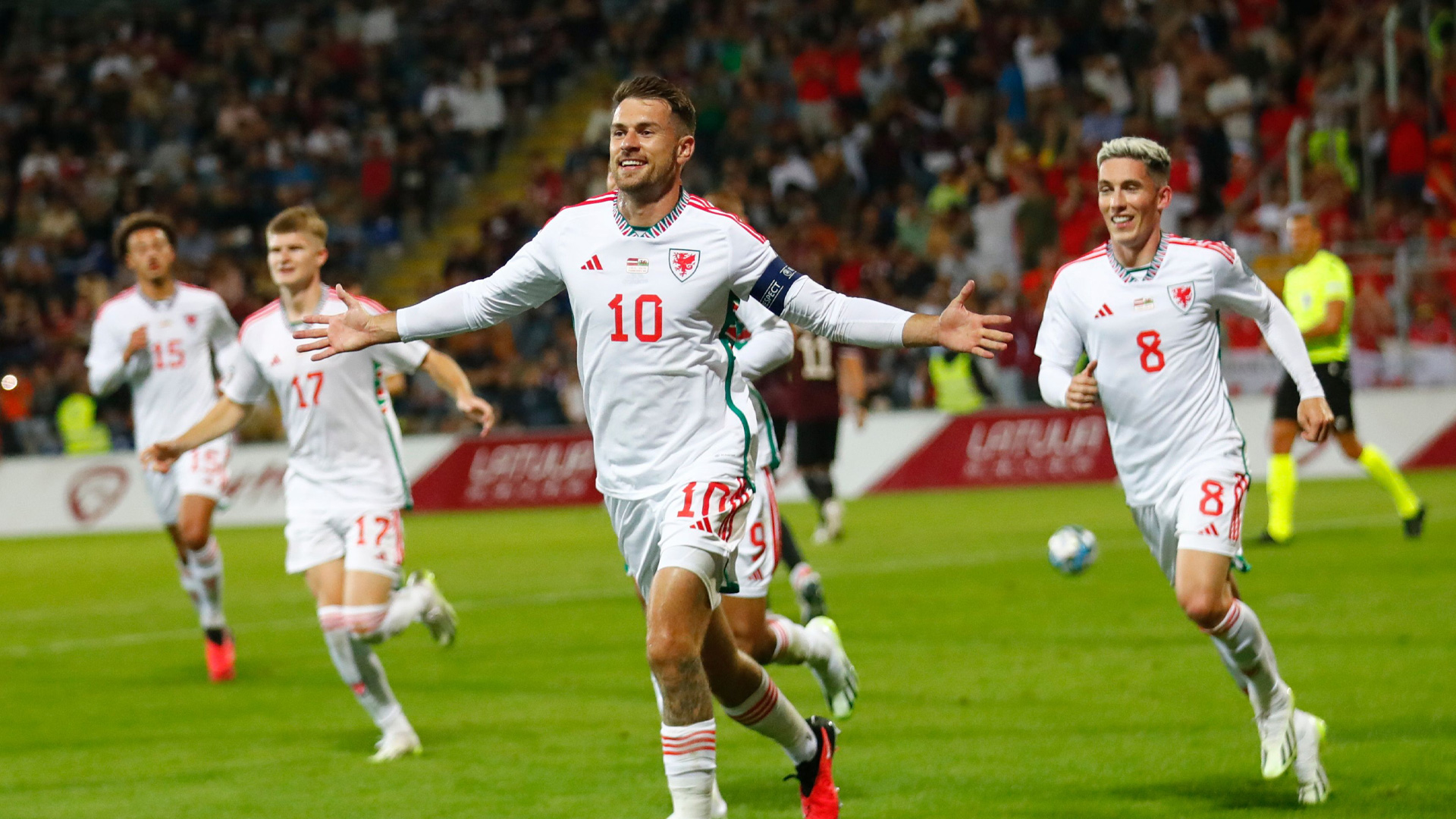 Aaron Ramsey celebrates scoring for Wales