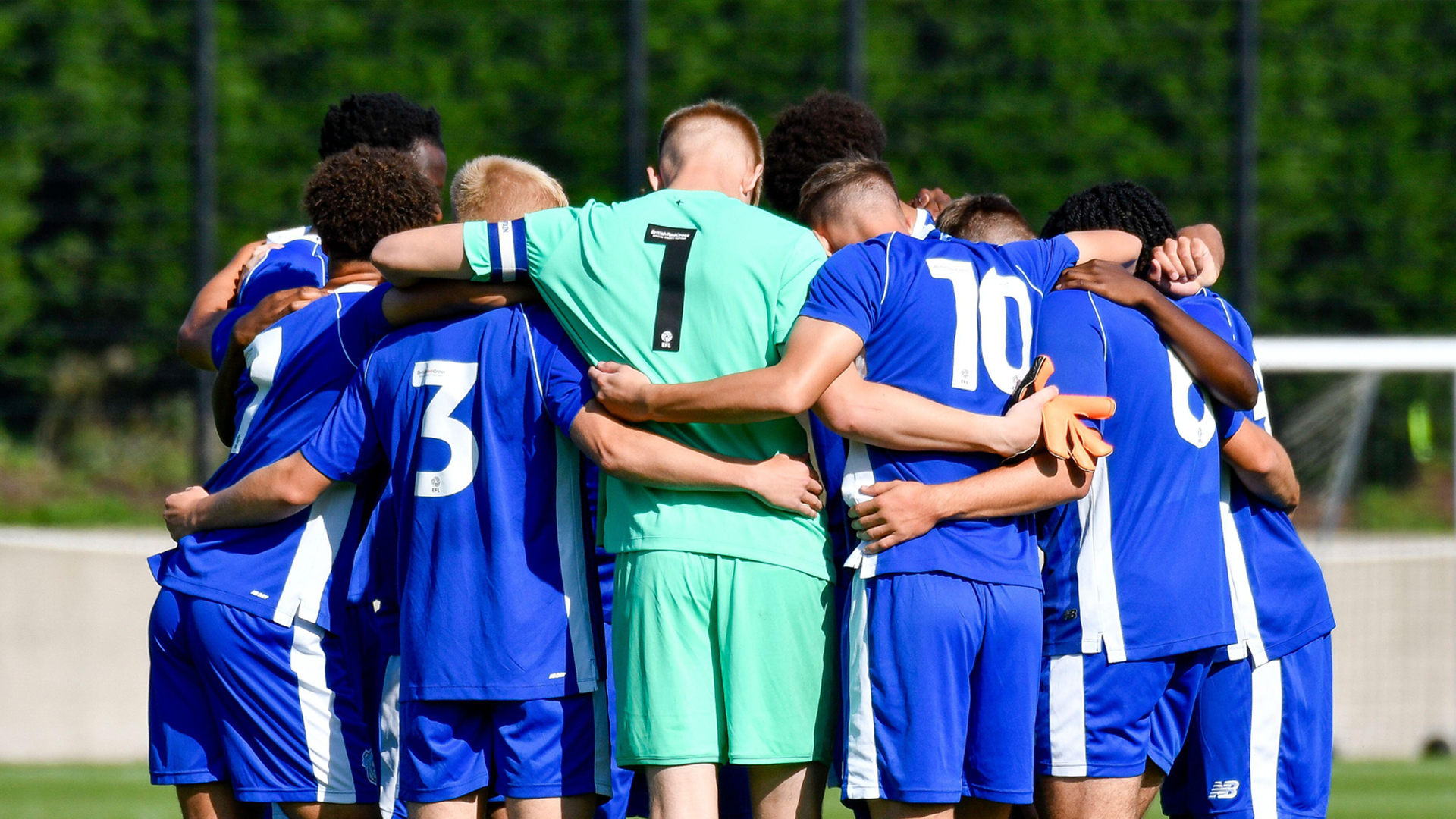 U18 side huddles pre-match