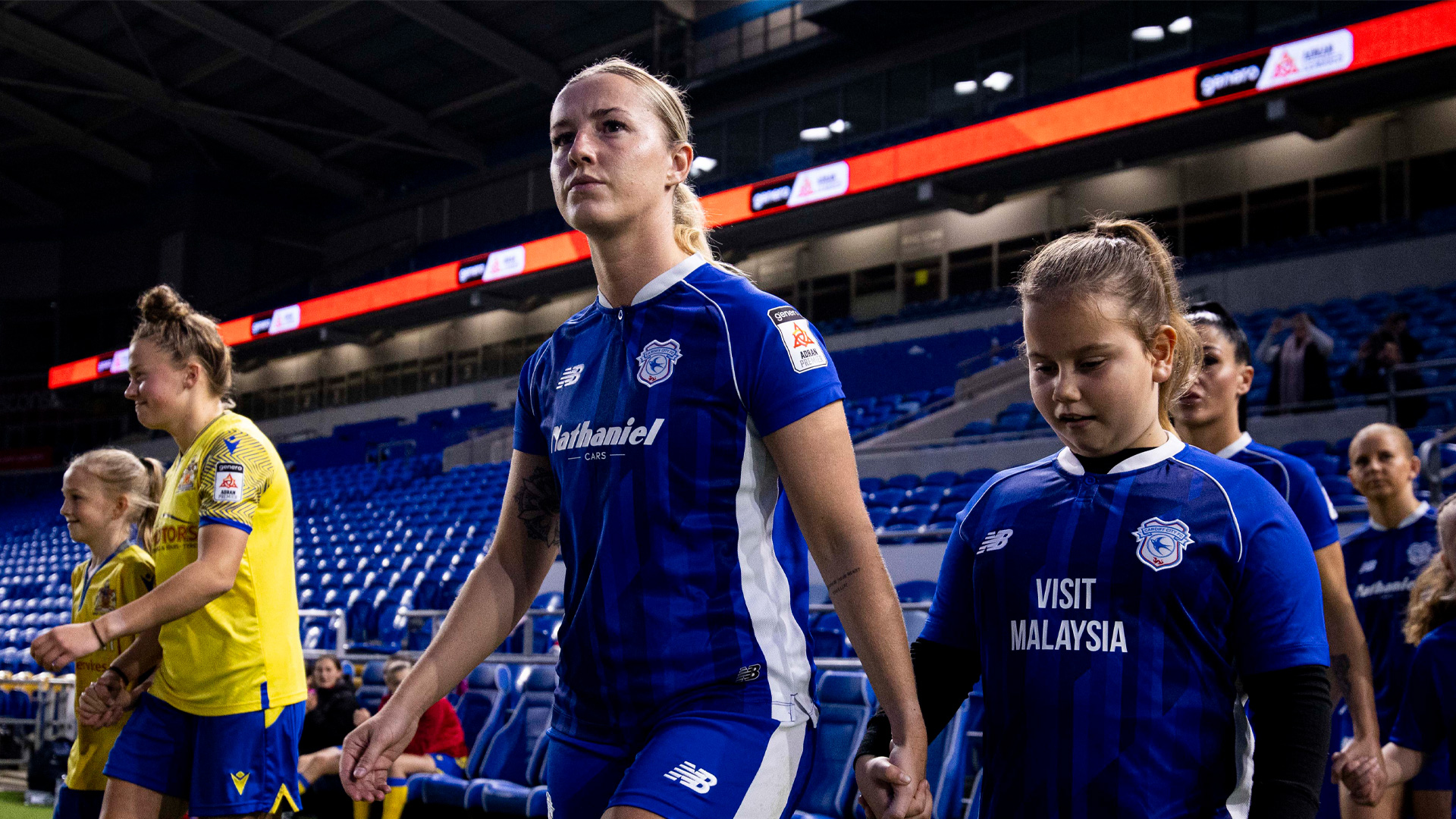 Danielle Green walks out onto the pitch at Cardiff City Stadium