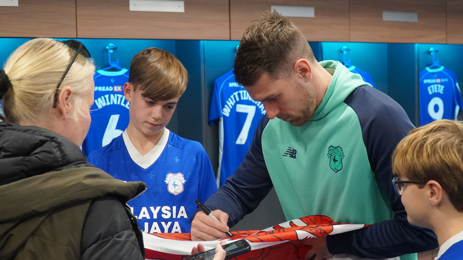 Aaron Ramsey interacts with Cardiff City fans