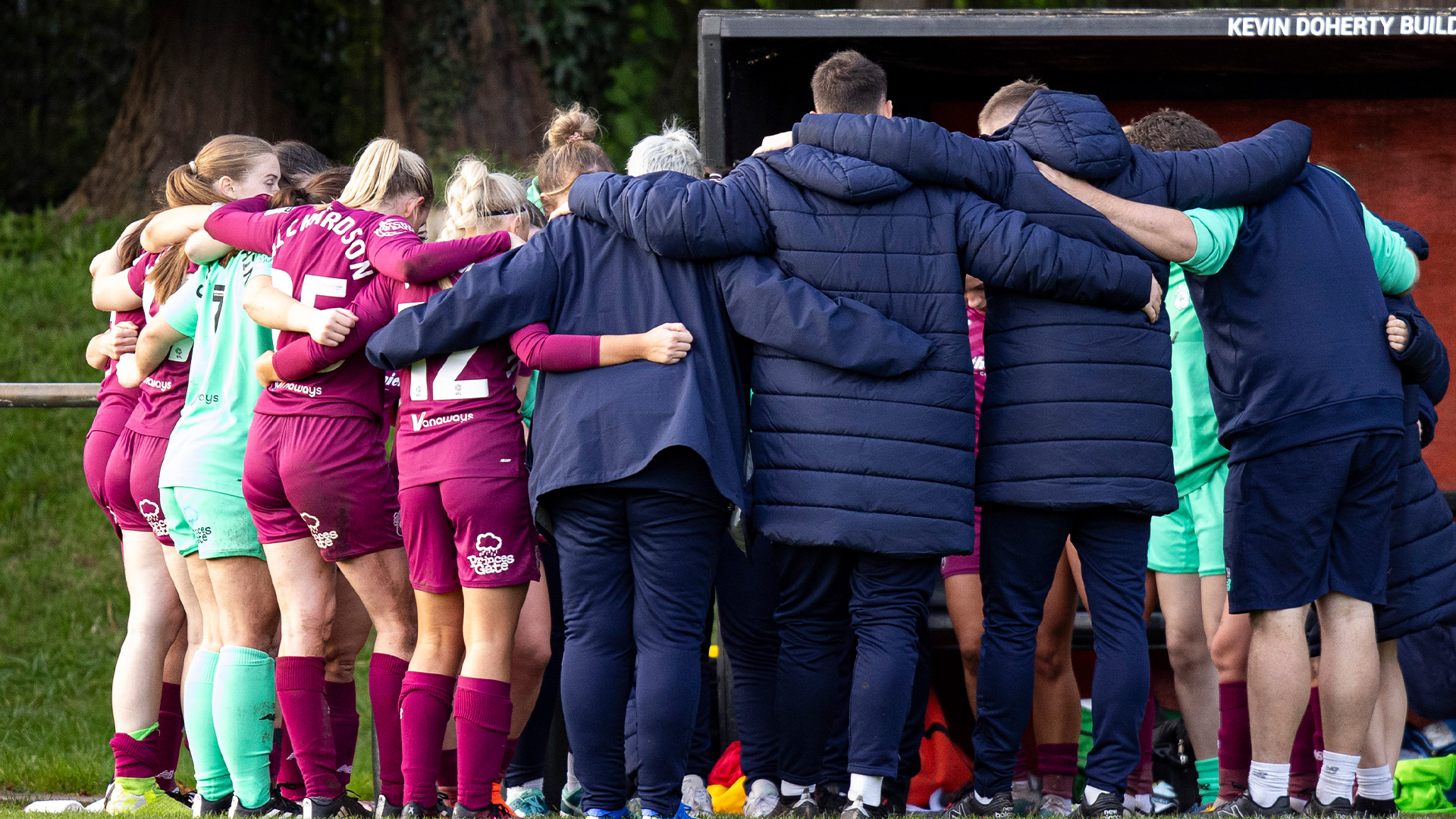 Cardiff City Women huddle after beating Swansea City Women