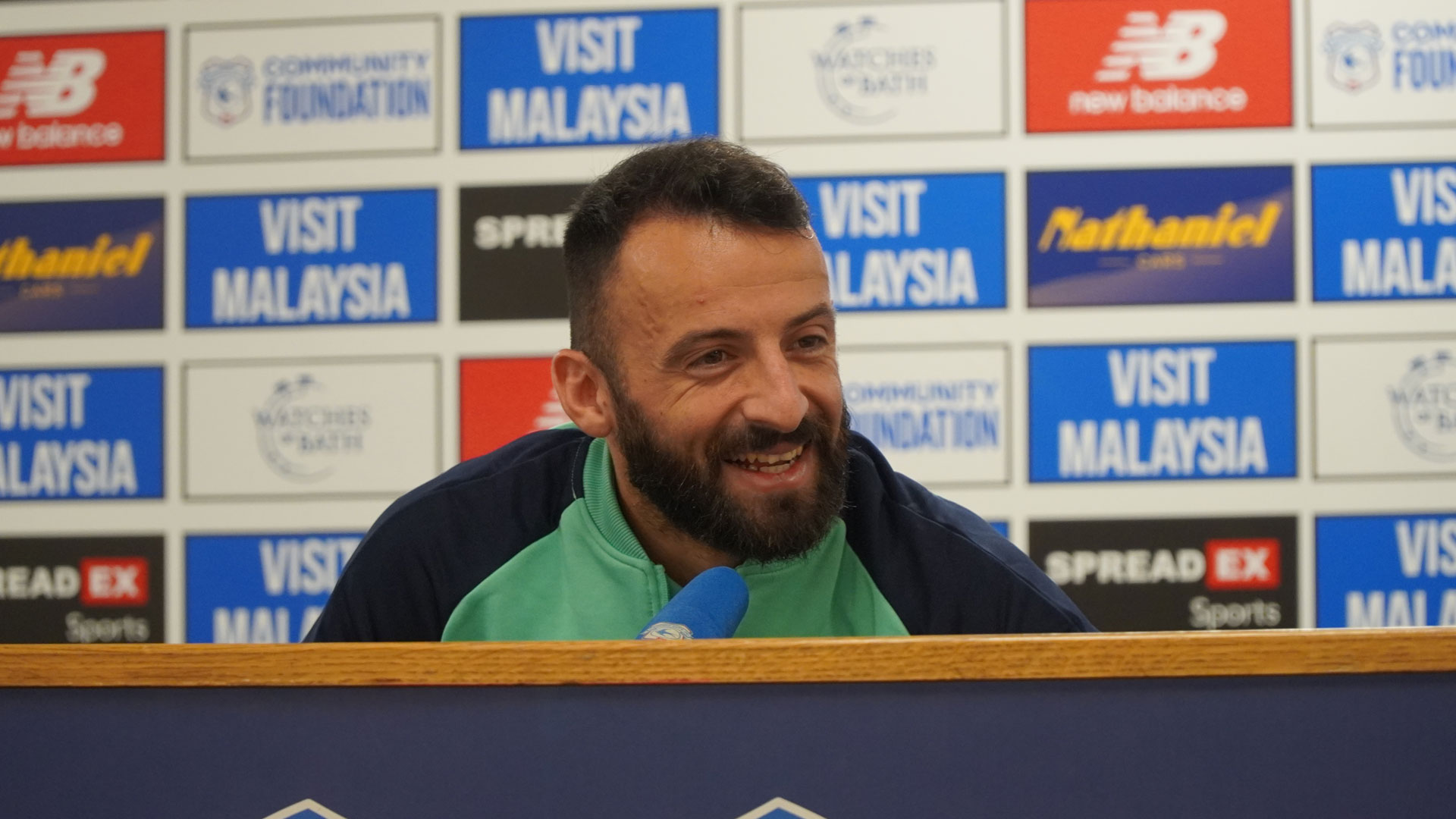 Manolis Siopis speaks to the press