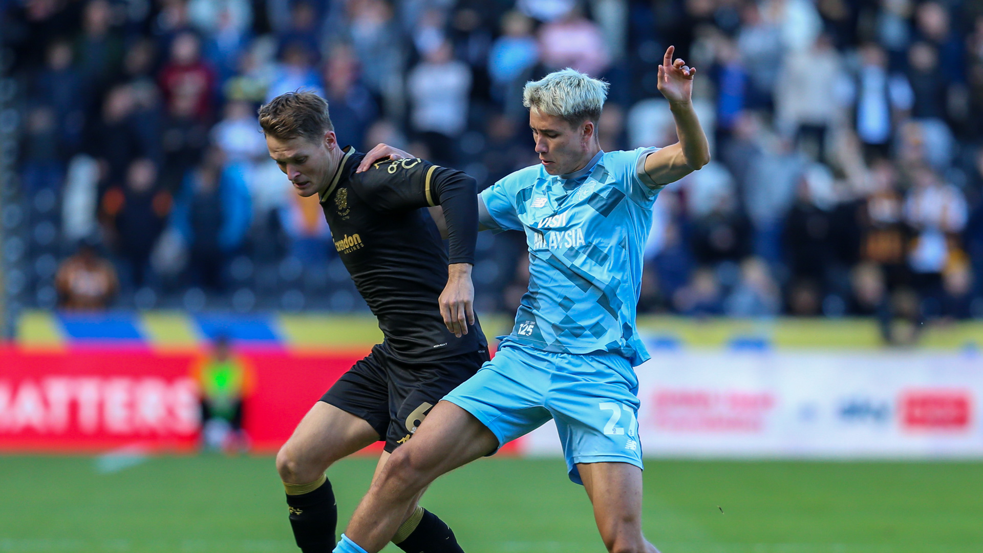 Rubin Colwill battles against Hull City...