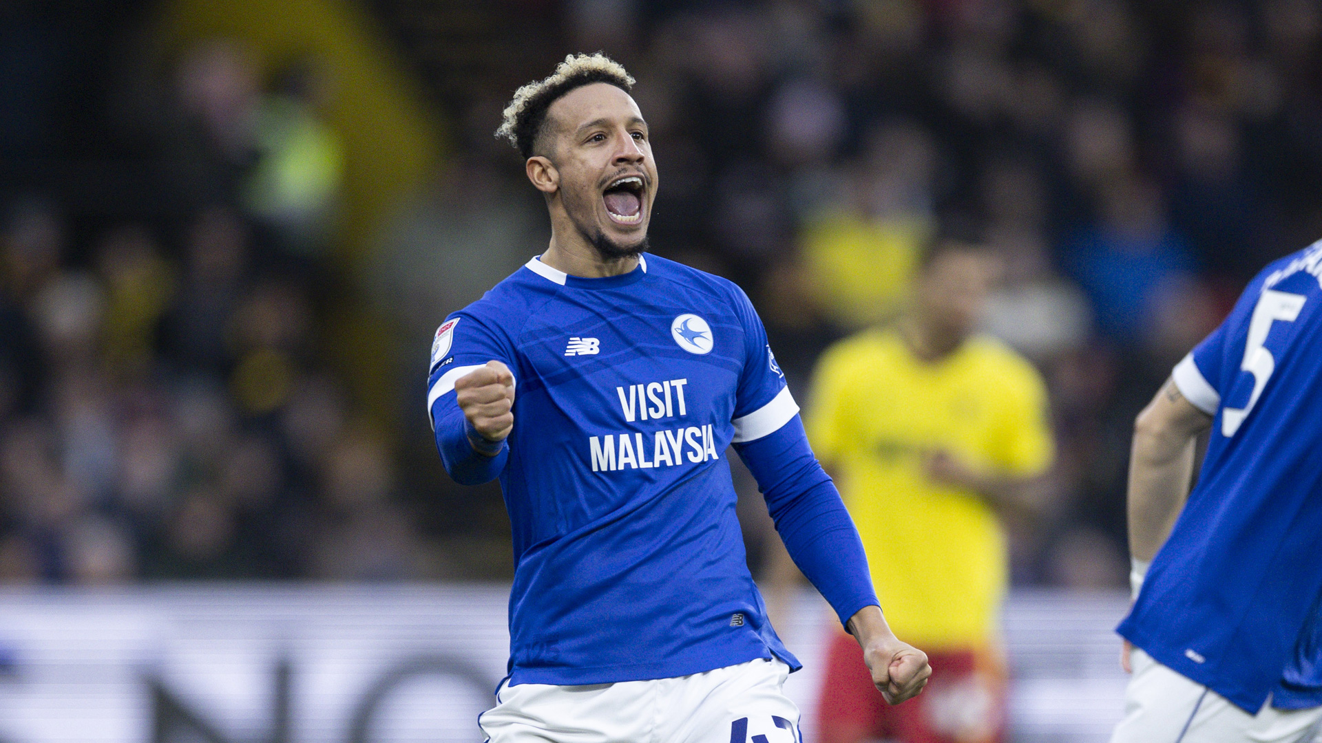 Callum Robinson celebrates at Vicarage Road...