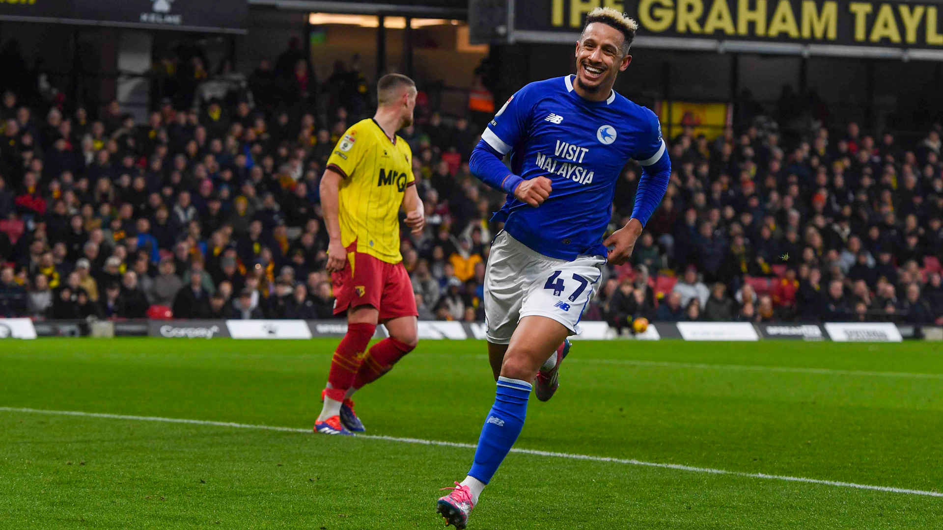 Callum Robinson celebrates at Vicarage Road...