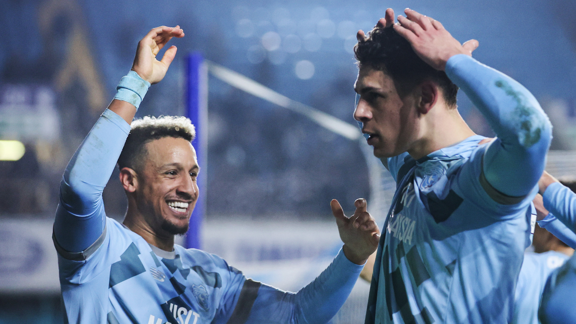 Yousef Salech celebrates his equalising goal against Millwall with Callum Robinson...