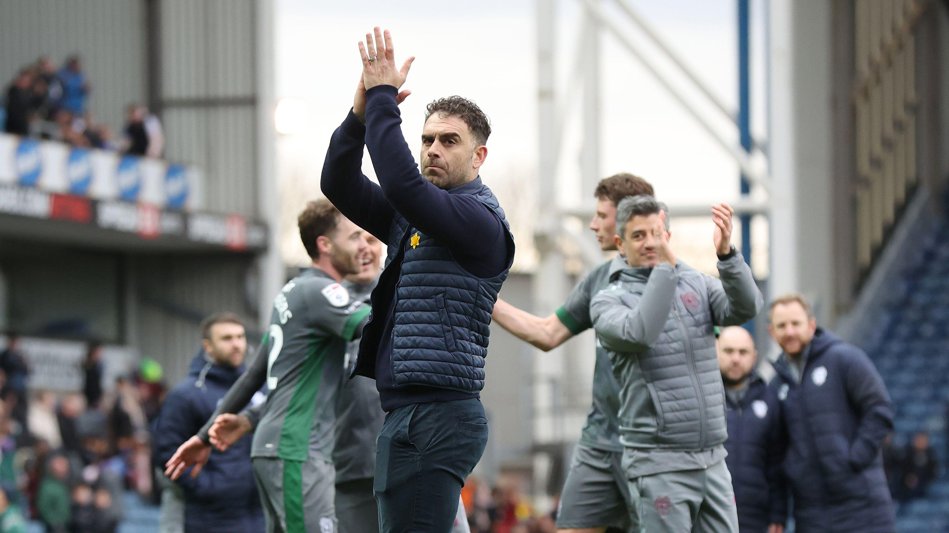 Omer Riza applauds the City support at the end of the match in Blackburn...