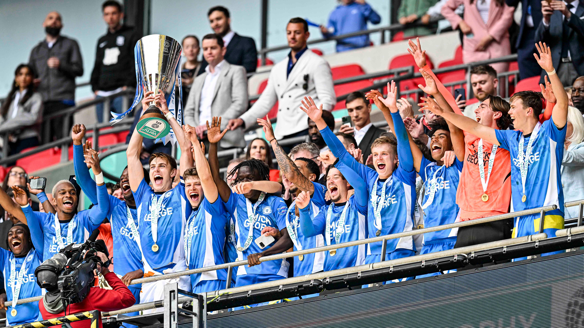 Peterborough United celebrate their Vertu Trophy success...