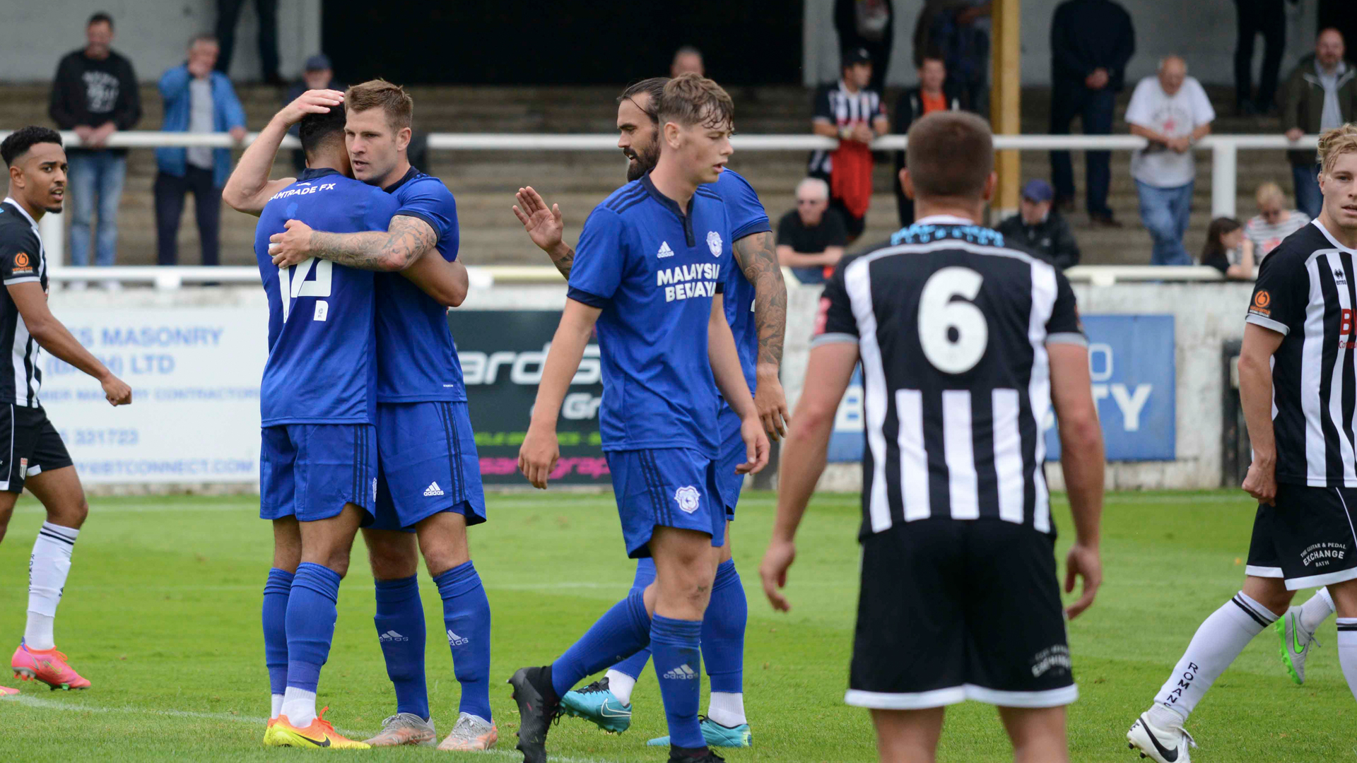 Isaac Vassell celebrates with James Collins...