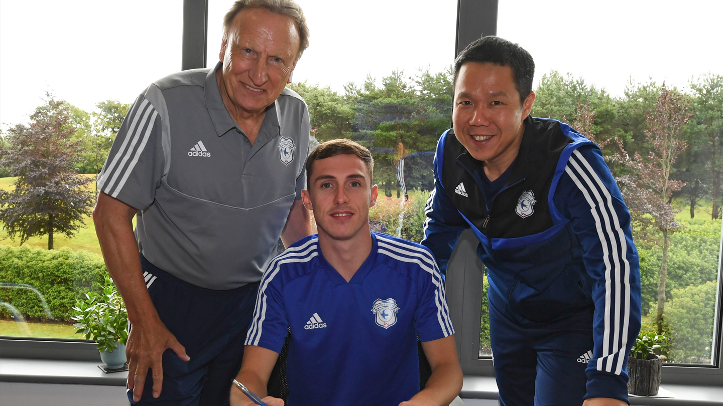 Gavin Whyte with Executive Director & CEO Ken Choo and Manager Neil Warnock