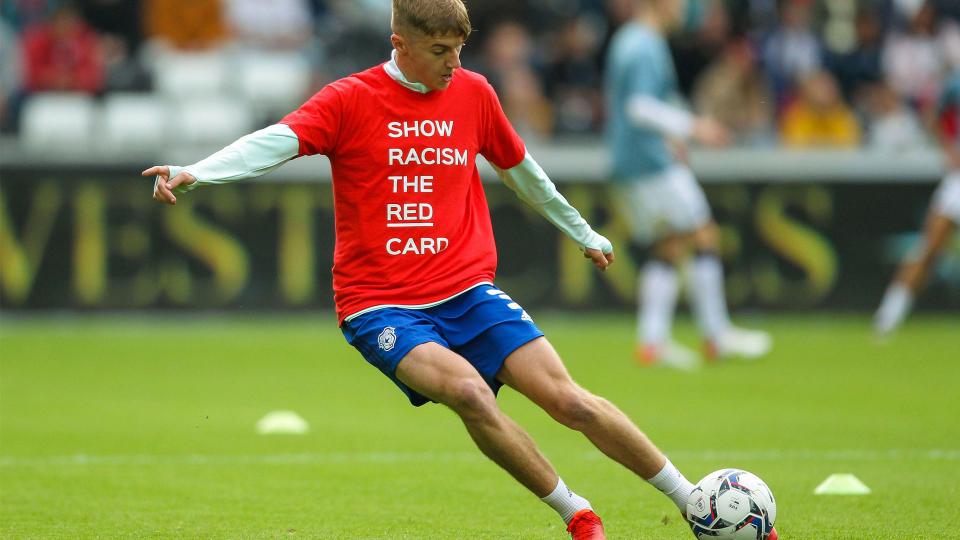 Joel Bagan wears the SRTRC shirt...