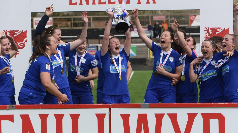 Mikayla Cook lifts the trophy...