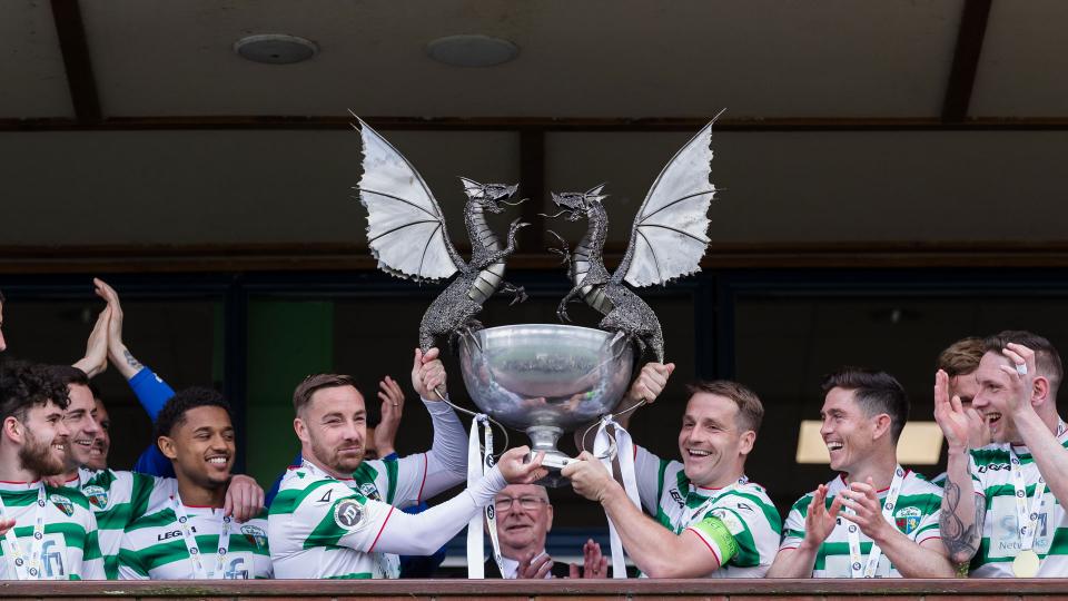TNS celebrate after winning the title in 2023...