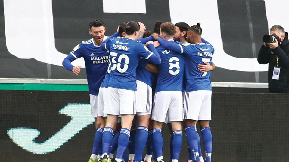 The Bluebirds celebrate Aden Flint's goal in Swansea...