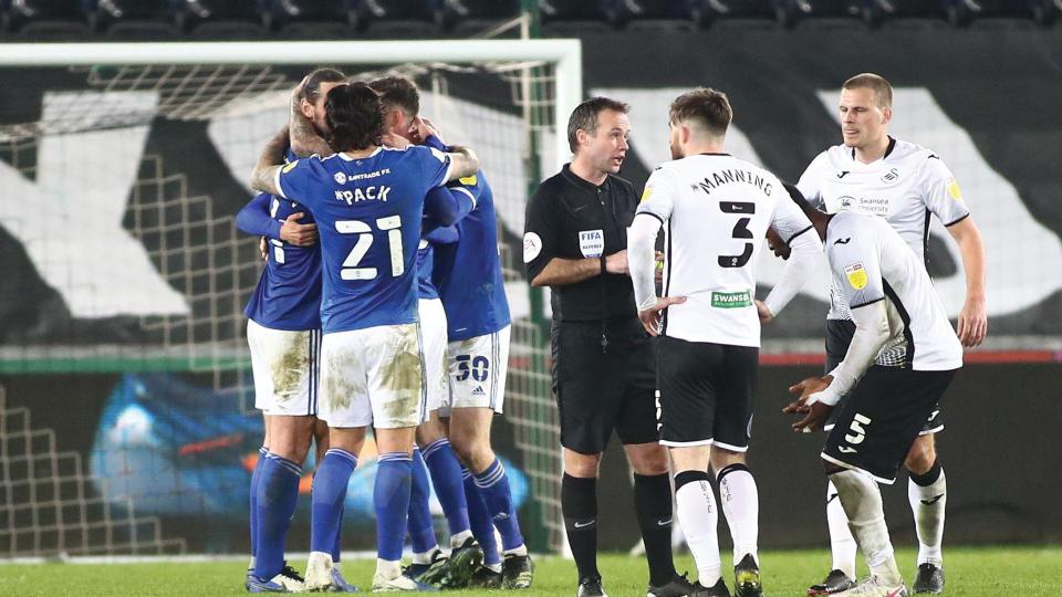 The Bluebirds celebrate Aden Flint's goal in Swansea...