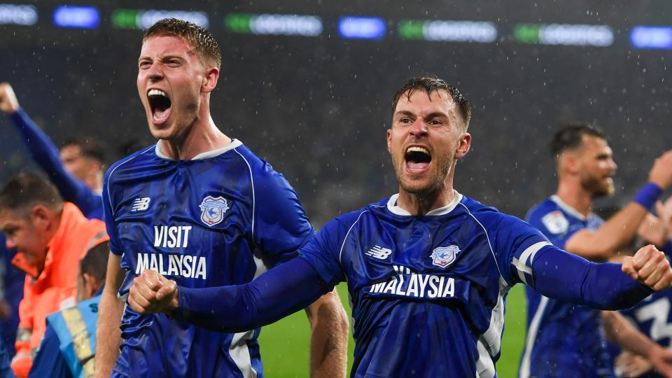 Mark McGuinness and Aaron Ramsey celebrate...