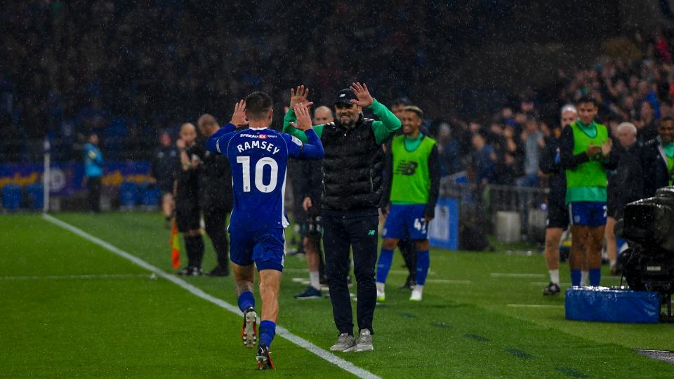 Aaron Ramsey celebrates with Erol Bulut...