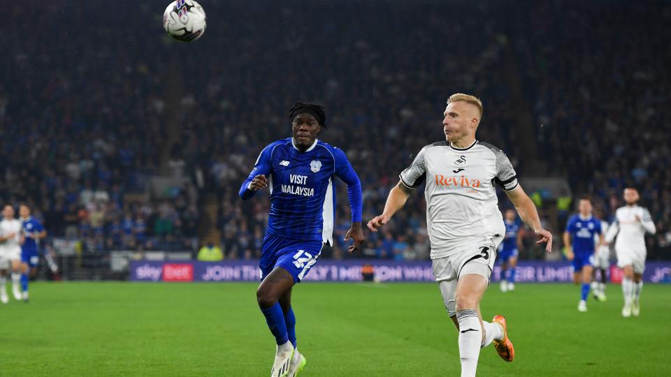 Ugbo challenges for the ball against Swansea City...