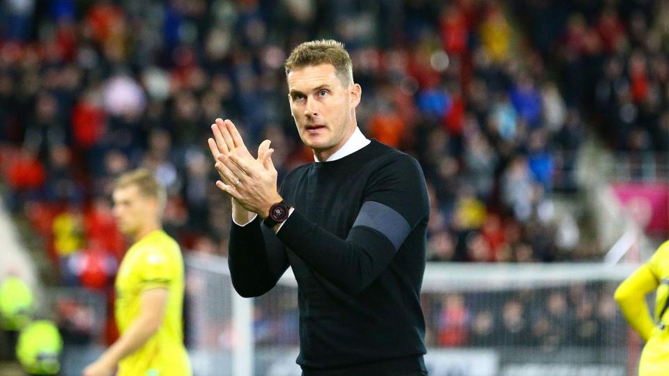 Matt Taylor applauds the Rotherham United fans