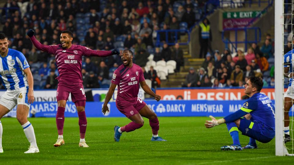 The Bluebirds celebrate their first goal against Huddersfield Town...